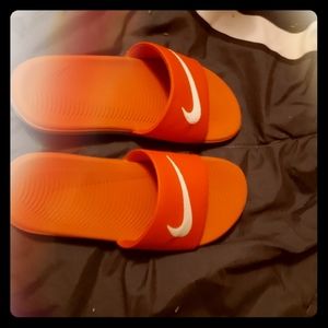 Red Nike slides